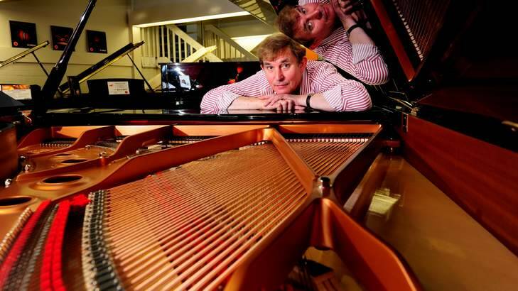 TUNED IN: Tony Magee, manager of DW Music's piano showroom in Fyshwick, says that their acoustic pianos still outsell the digital. Photo: Melissa Adams