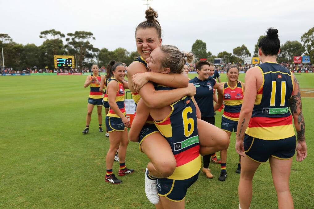 Talia Radan and Ebony Marinoff of the Crows celebrate their win. Photo: James Elsby