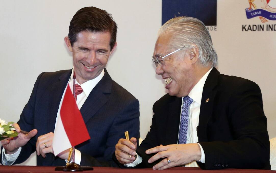 Australian Trade Minister Simon Birmingham, left, and Indonesian Trade Minister Enggartiasto Lukita at the  signing ceremony in Jakarta, Indonesia, on Monday. Photo: AP