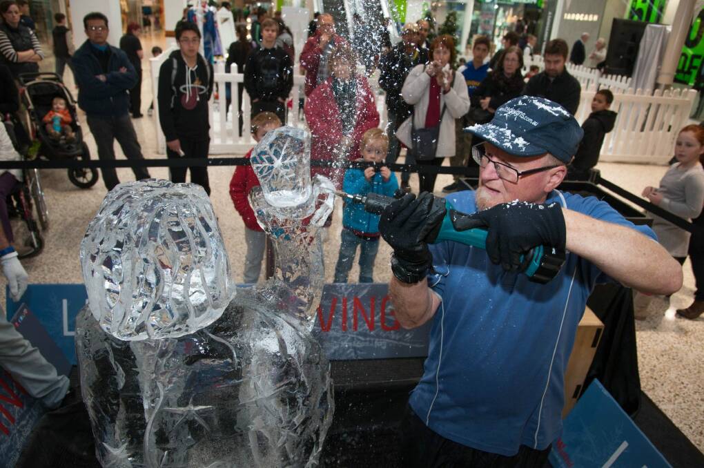 For artist Glenn Smith, creating ice sculptures in the comfortable temperatures of Woden Westfield is proving a challenge this week.