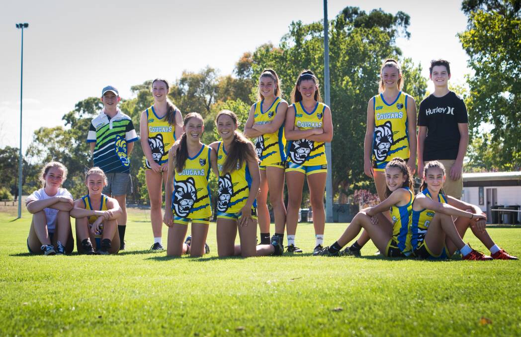 The under 15 girls Oztag team (with two of their brothers)  (front) Chloe and Nellie O’Donnell, Maddie and Ellie Hyland, Samantha and Kaylee Charlton, and (back) Cambell and Georgia Willey, Abbie and Samantha Bailey (all 14) with Sara and William Hannaford (15).  Photo: Elesa Kurtz