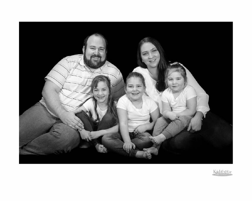 The family in happier times before the crash: Lachlan Wilson and Cassandra Weller with daughters Paityn, Millicent and Annabelle
