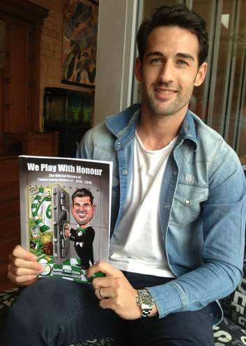 Canberra's Socceroos star Carl Valeri with the history of Tuggeranong FC book.