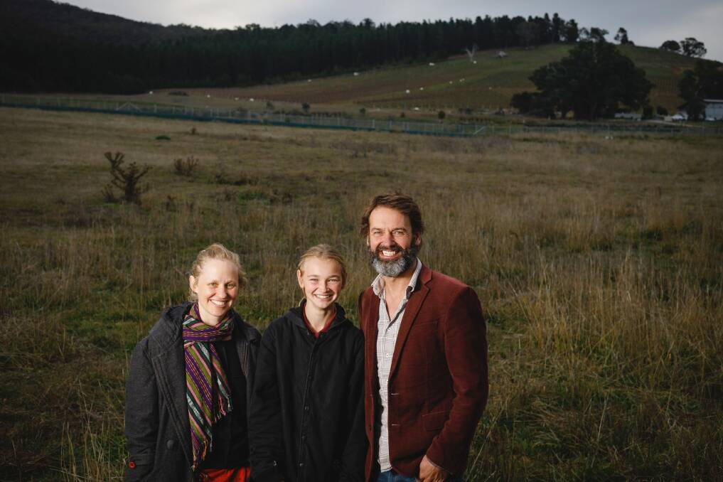 Deb Cleland, Reuben Layton Thompson, and Jeff Layton Thompson are set to invest several thousand in Australia's largest community-owned solar farm proposed for this site at Majura. Photo: Sitthixay Ditthavong