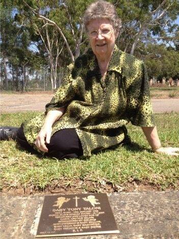 Weston grandmother Carol Taloni at Rookwood Cemetery in Sydney with a plaque commemorating her son, Tony, and five other stillborn babies.