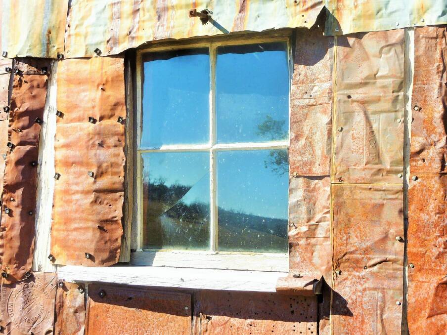 Detail of window and kerosene tin clad walls of Four Mile Hut. Photo: Tim the Yowie Man