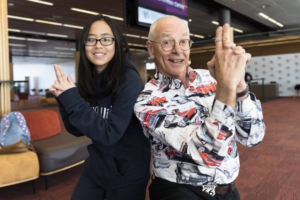 Shalina Do of Lanyon High School and Dr Karl Kruszelnicki strike a pose. Photo: Lawrence Atkin
