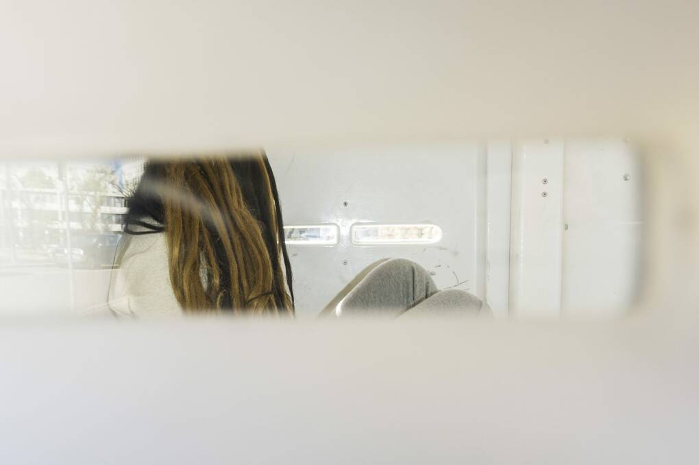 The accused: Gabriela Woutersz arrives at court last year in the back of a police van. Photo: Rohan Thomson