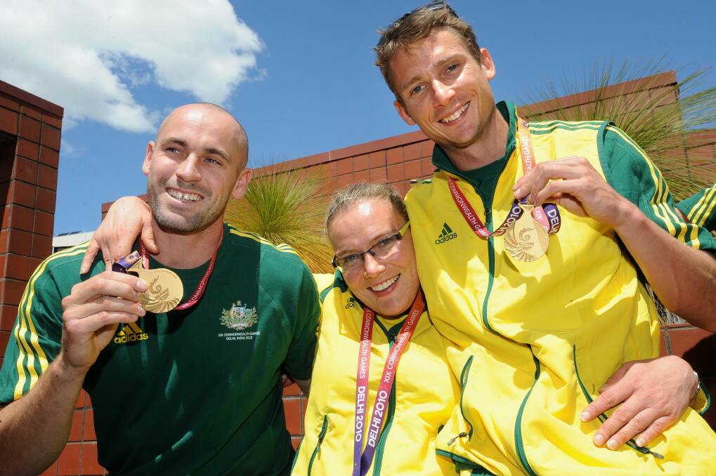 Louise Ellery with fellow Canberra athletes Glenn Turner and Brendan Cole following their return from the 2010 Commonwealth Games in Delhi. Photo: Gary Schafer