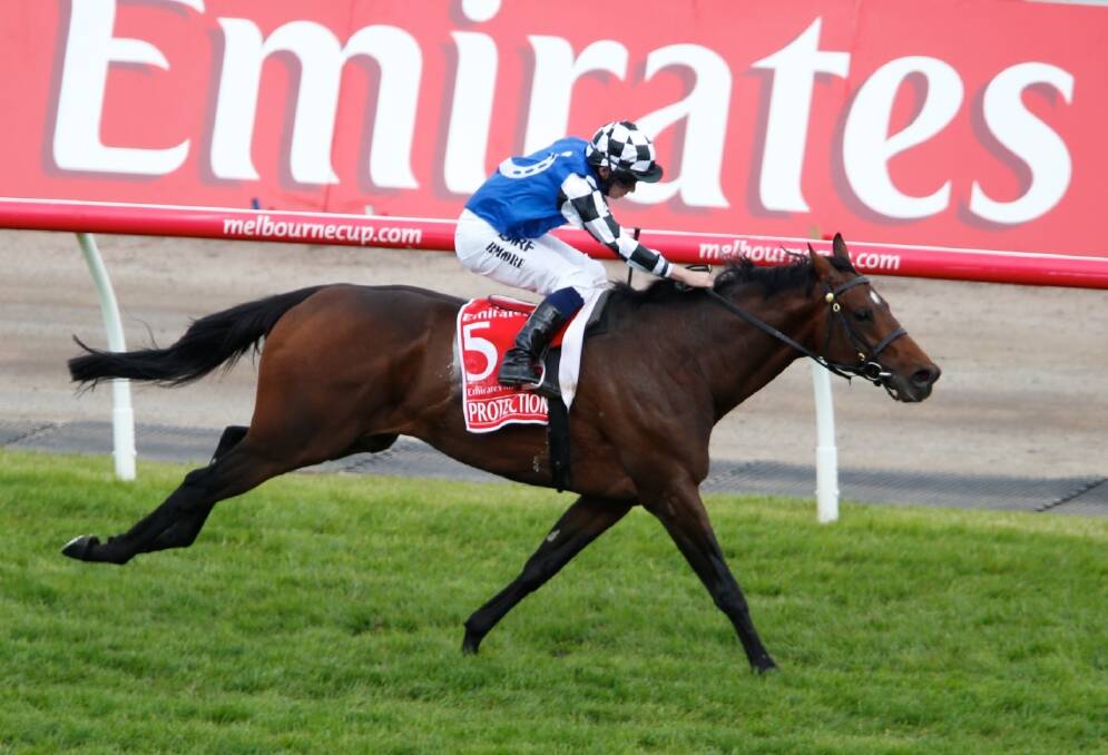 Protectionist and jockey Ryan Moore on their way to winning last year's Melbourne Cup. Moore will be aboard Snow Sky this year. Photo: Eddie Jim