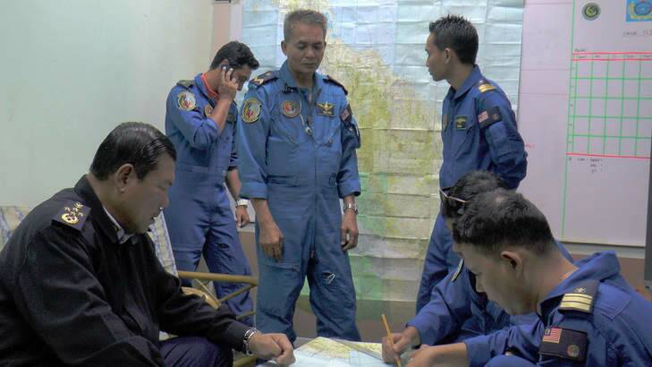 Malaysia's Maritime Enforcement personnel during search and rescue operations of missing flight MH370. Photo: AFP