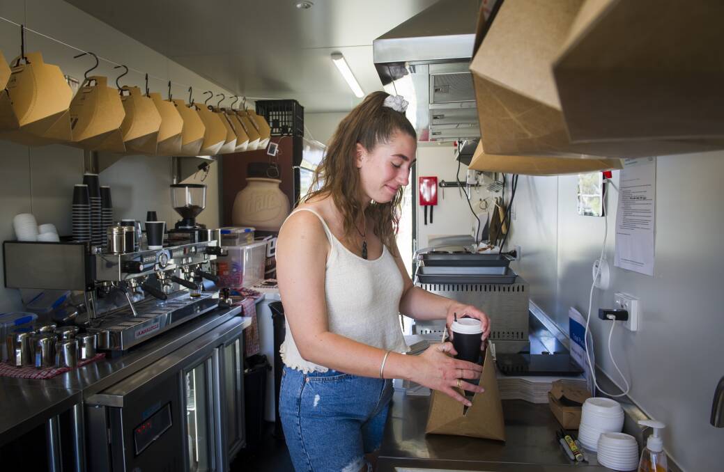 Barista Lily Viduka, from Kickstart Expresso, prepares my vanilla latte. Photo: Elesa Kurtz