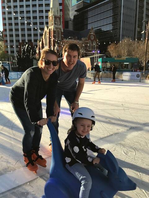 Penny and Nathan Smith from Warner take to the ice rink with daughter Madison, 3. Photo: Alison Brown