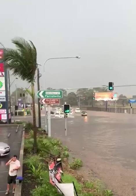 Localised flooding in Parramatta along James Ruse Drive on February 8.  Photo: Steven Issa