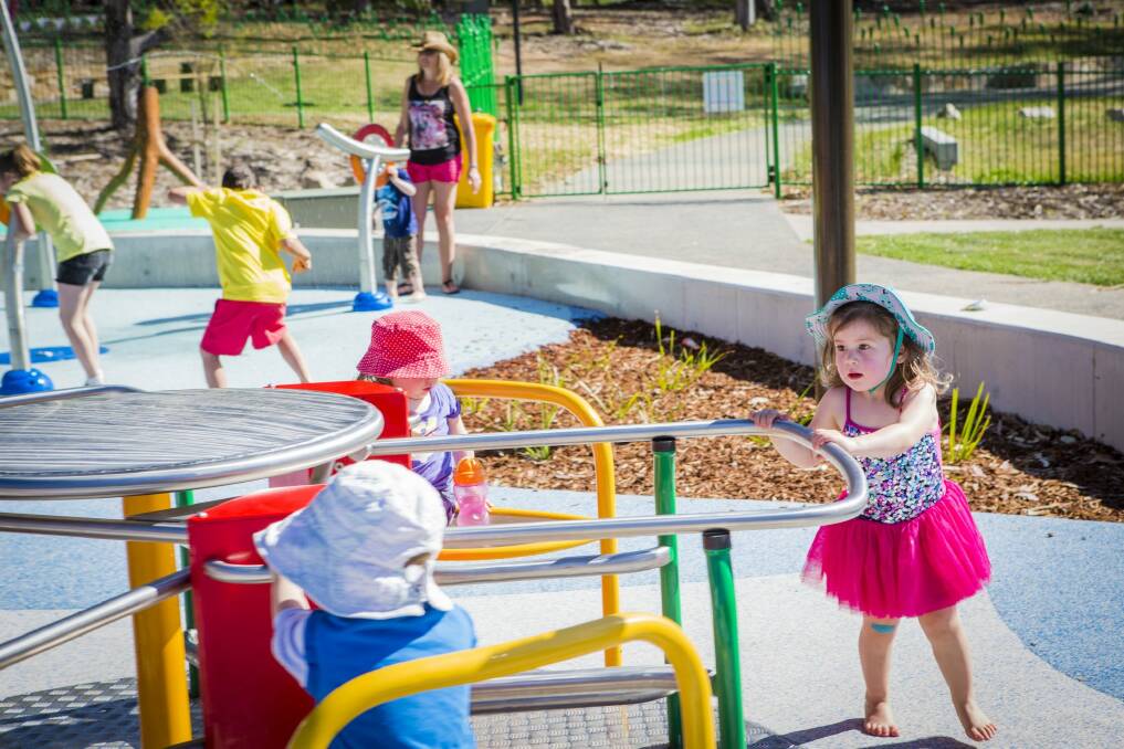 TUTU POWER: Scarlett Trotter 3, of Duffy, gets to grips with the new play equipment on the first day of Boundless Canberra all Abilities playground.  Photo: Jamila Toderas