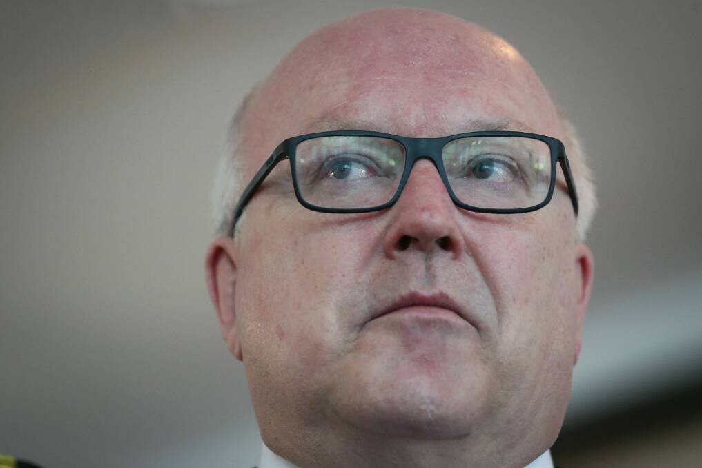 Canberra's legal fraternity has urged federal Attorney-General George Brandis to reverse savage cuts to the legal aid sector.  Photo: Alex Ellinghausen