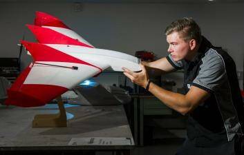 XTEK technician, Mark Allen,  with an unmanned aerial vehicle. Photo: Rohan Thomson