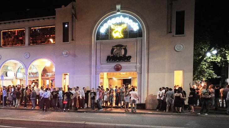 Revelers wait in line to enter Mooseheads night club in the city. Photo: Andrew Sheargold