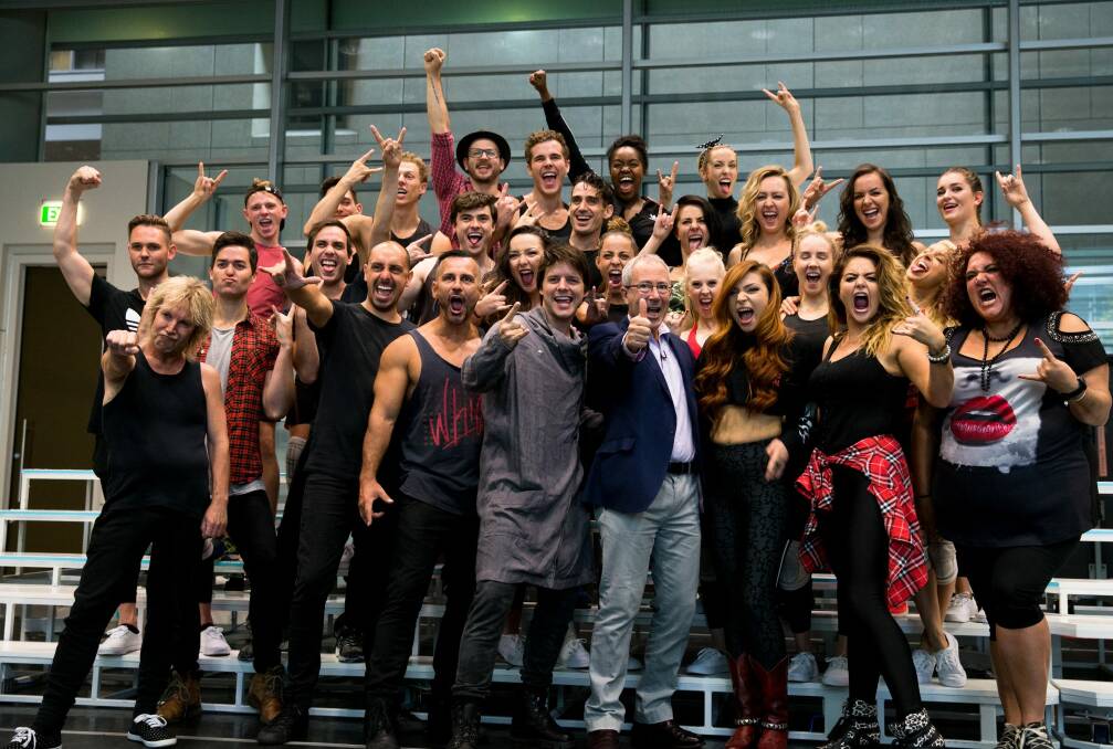 Writer and director Ben Elton (front row, in blue jacket) with the cast of We Will Rock You, in  Sydney. Photo: Janie Barrett