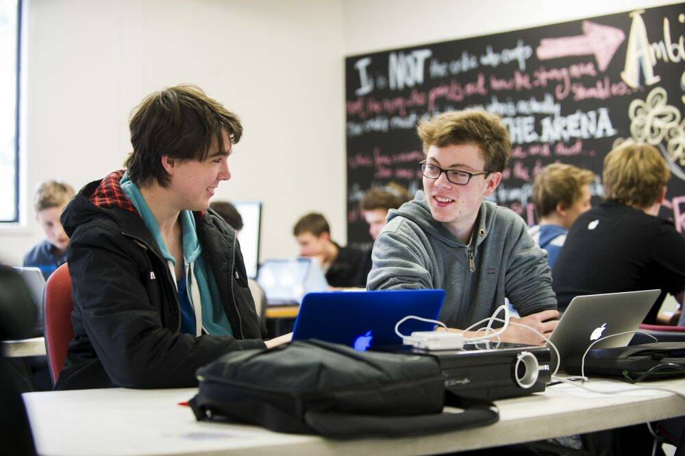 Canberra Grammar School students James Treloar and Sam Moore conspire at GovHack. Photo: Rohan Thomson