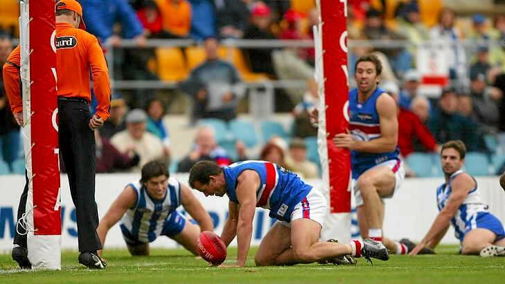 North Melbourne takes on the Bulldogs at Manuka Oval in 2004, back when the Kangaroos called Canberra 'home'. Photo: Getty Images