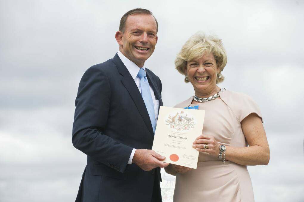 Prime Minister Tony Abbott with new Australian Hilary Kay at the Australia Day Citizenship Ceremony. Photo: Rohan Thomson