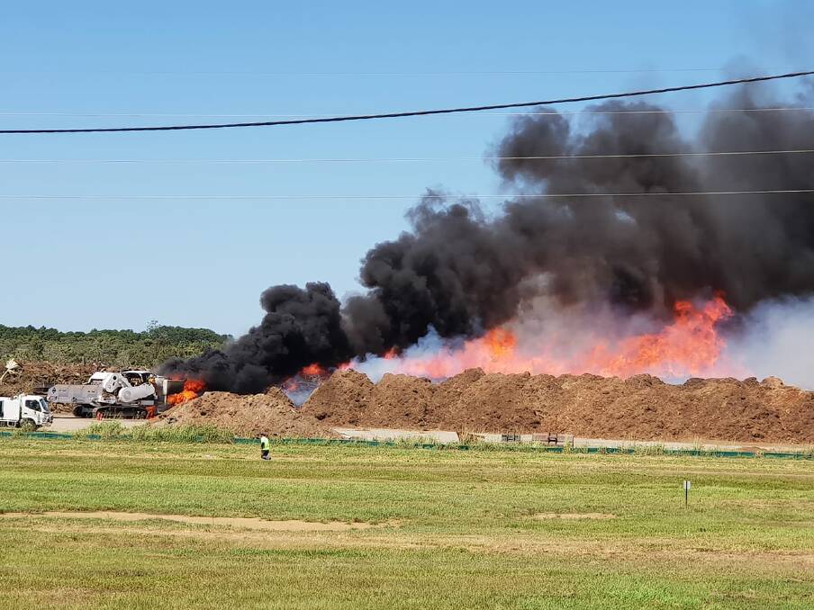 A mulch machine is on fire at a Caboolture tip, north of Brisbane. Photo: Tyarna Gerrey.