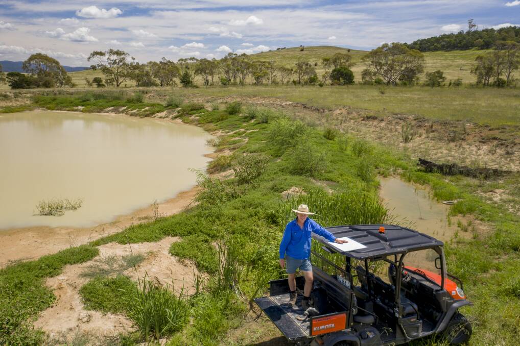 Braidwood farmer Martin Royds beside one of his first moated dams, which is starting to fill up. Photo: Sitthixay Ditthavong