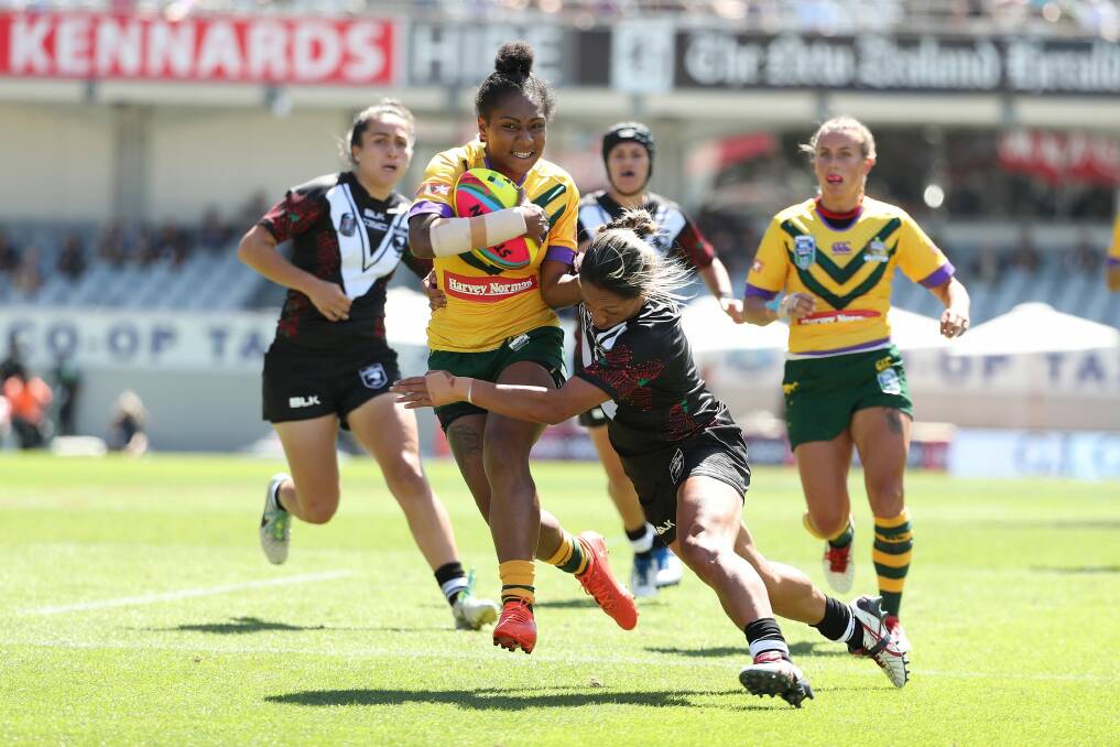Bursting through: Amelia Kuk, (pictured playing Nines), will debut in the 13-a-side game against her native Papua New Guinea. Photo: NRL Photos
