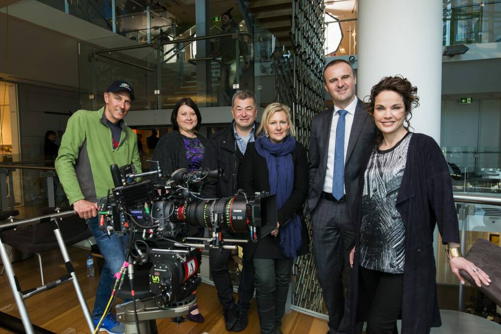 (From left) Director of photography Bruce Young, Screen ACT Director Monica Penders, director Shawn Seet, <i> The Code</i> writer Shelley Birse, Chief Minister Andrew Barr, and actress Sigrid Thornton on set on Tuesday. Photo: Rohan Thomson