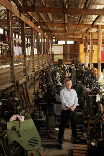 Peter Crisp stands amongst some sock making machine's that sit in his restored Shearing Shed that he hopes will become the Yass Valley Woollen Mill at his Bowning property. Bowning. Photo: Colleen Petch