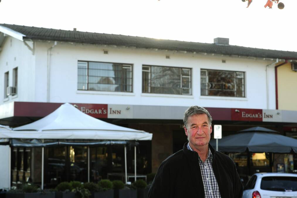 Jeff Darwin in 2015 outside his Ainslie shops building. The rood space in the flat above Edgar's Inn contains loose-fill Fluffy asbestos insulation. Photo: Melissa Adams