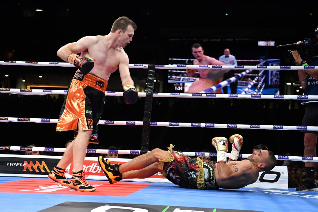 Next generation: Jeff Horn stands over Anthony Mundine as he hits the canvas. Photo: Darren England