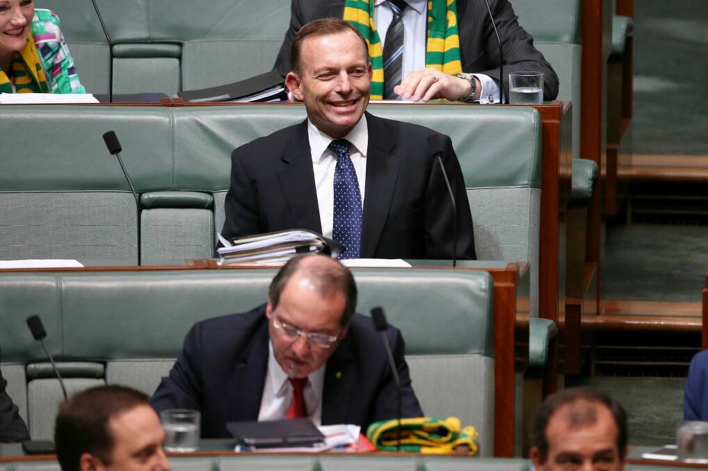 Former prime minister Tony Abbott sits behind Eden-Monaro MP Peter Hendy in Parliament in November. Photo: Alex Ellinghausen