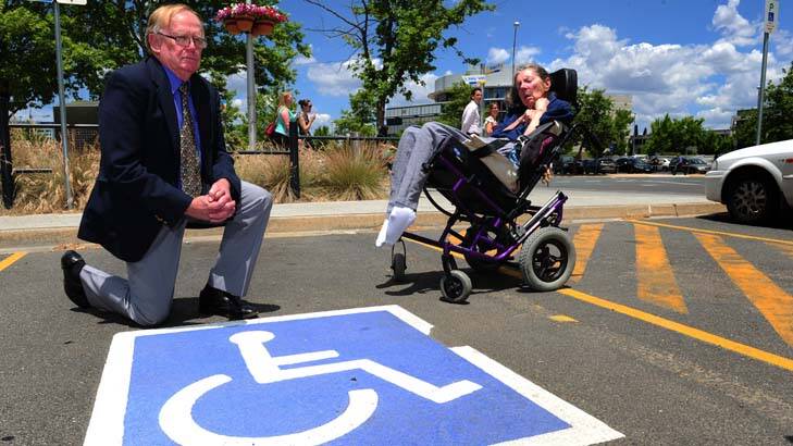 Roy and Jennifer Edgar at one of the new disabled car spaces in the City. Photo: Melissa Adams