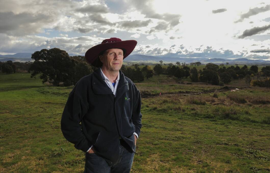 David O'Keeffe, director of Woodhaven Investments, at the Belconnen Magpies Golf Club, where 350 dwellings will soon be built. Photo: Graham Tidy