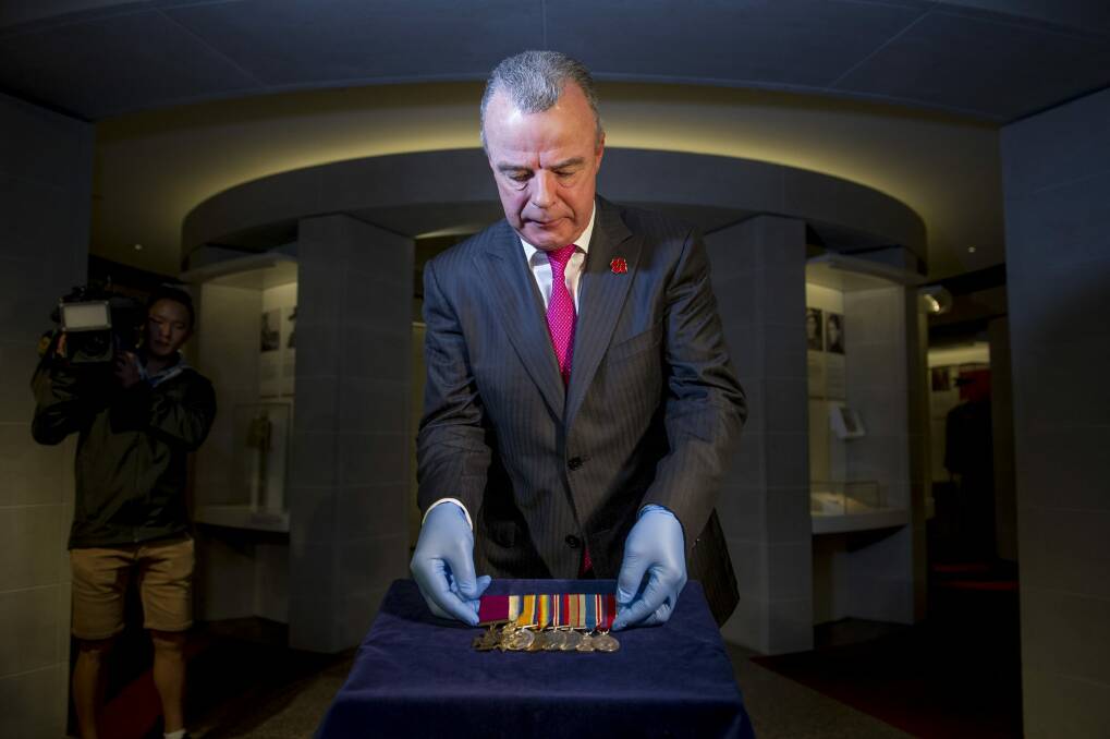 Australian War Memorial director Brendon Nelson unveils Private William Jackson's Victoria Cross medal. Photo: Jay Cronan