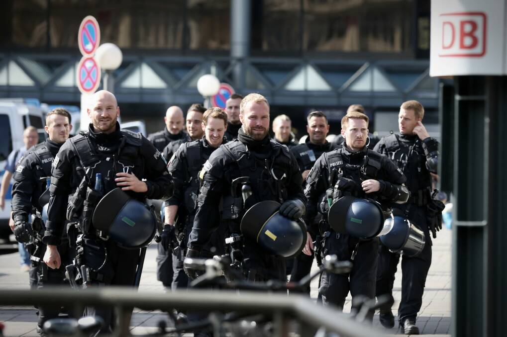 Riot police patrol ahead of the G20 in Hamburg. Photo: Andrew Meares