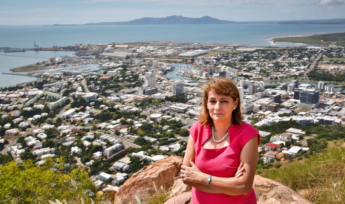 Townsville Mayor Jenny Hill on top of Castle Hill  with Townsville in the background. Photo: supplied