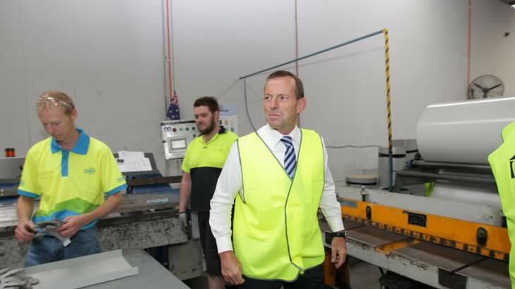 Opposition Leader Tony Abbott visits a building supplies business in Canberra. Photo: Alex Ellinghausen/Fairfax