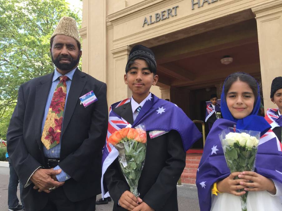Ahmadiyya Muslim Association Australia president, Imam Inam-ul-Haq Kauser with Fareed Rasheed and Sana Bajwa outside Albert Hall in Yarralumla. Photo: Stephen Jeffery