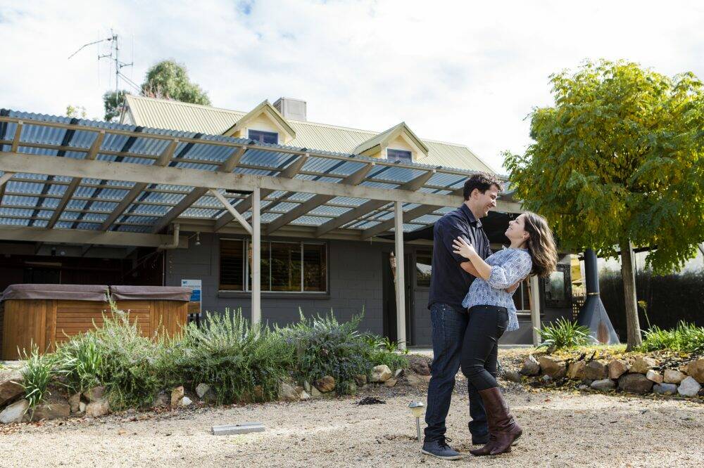 Rowland Fischer and fiancee Lisa Port outside their new home in Sutton. Photo: Jamila Toderas