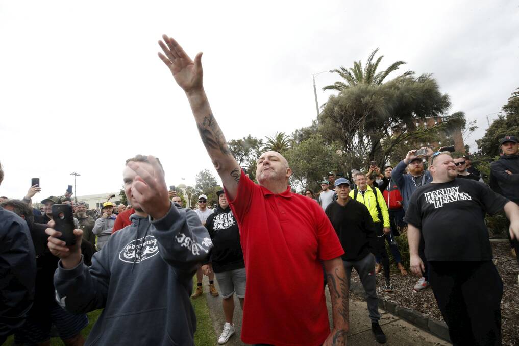 A protester issues a Nazi salute at Saturday's St Kilda rally. Photo: Darrian Traynor