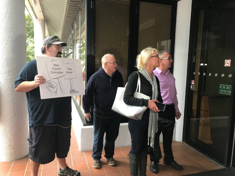 Ipswich Residents and Ratepayers Association members chanting outside the Ipswich City Council Administration Building on Wednesday. Photo: Amy Mitchell-Whittingdon