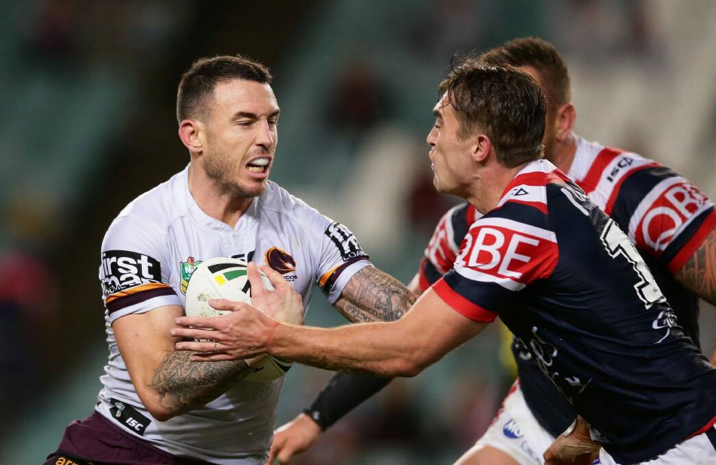 Keeping the defence at arm's length: Darius Boyd. Photo: Getty Images
