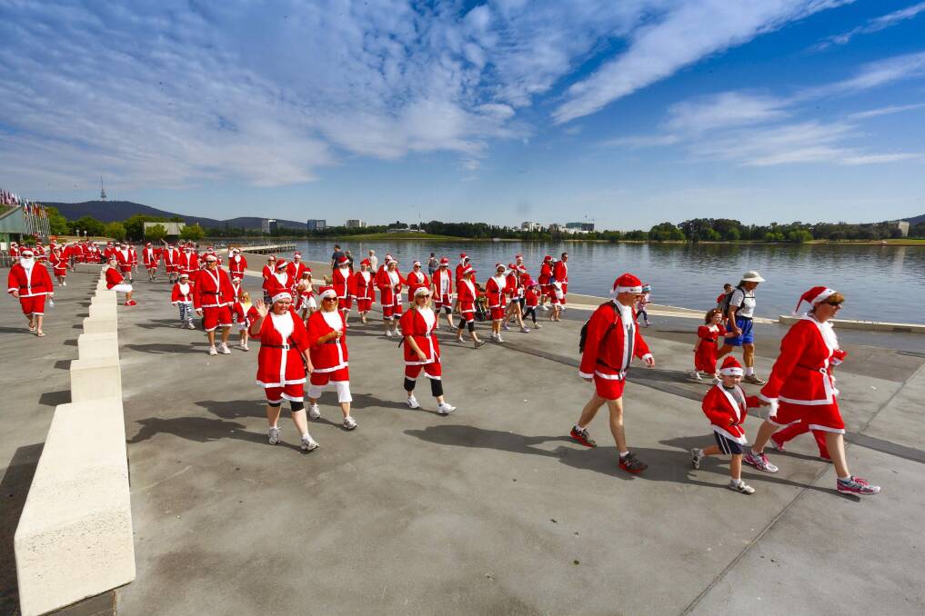 Crowds of Santas will don red suits and walk or run around the Lake for the 2014 Santa Fun Run. Photo: Supplied