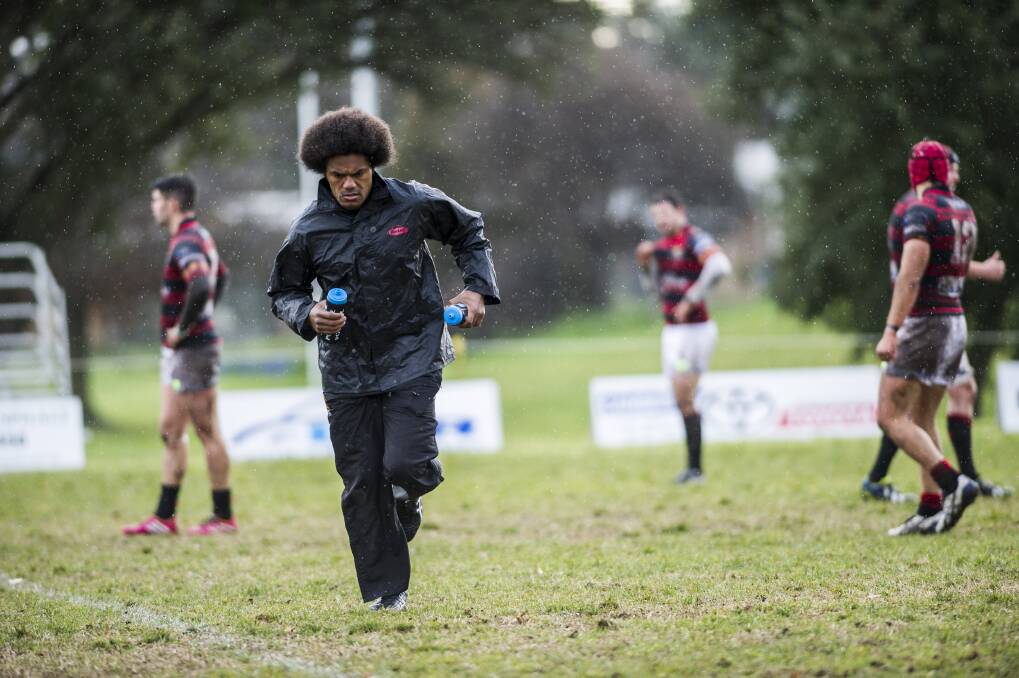 Henry Speight running water for the Gungahlin Eagles on a day off from Brumbies duties. Photo: Rohan Thomson