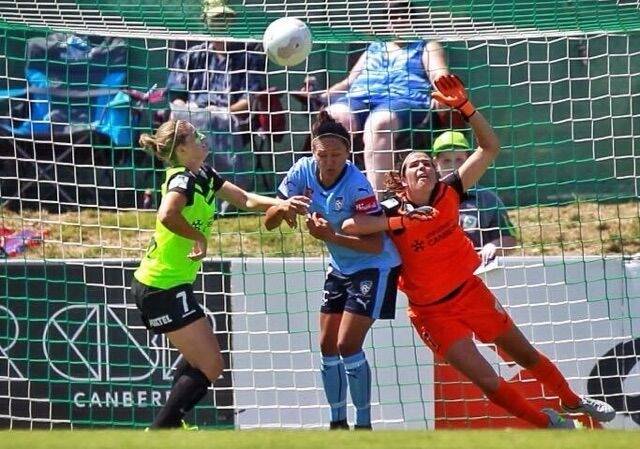 Canberra United goalkeeper Lydia Williams is obstructed by Sydney FC striker Kyah Simon. Photo: Supplied