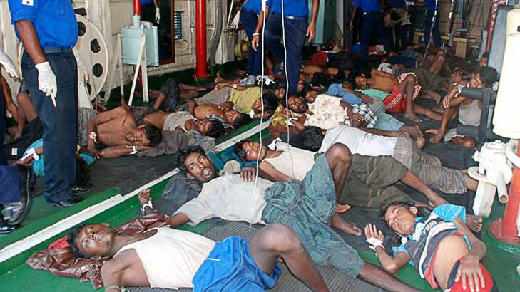 In recovery ... thirty-two Burmese asylum seekers rescued off Sri Lanka's eastern coast rest on the floor at a hospital in Galle. Photo: AP