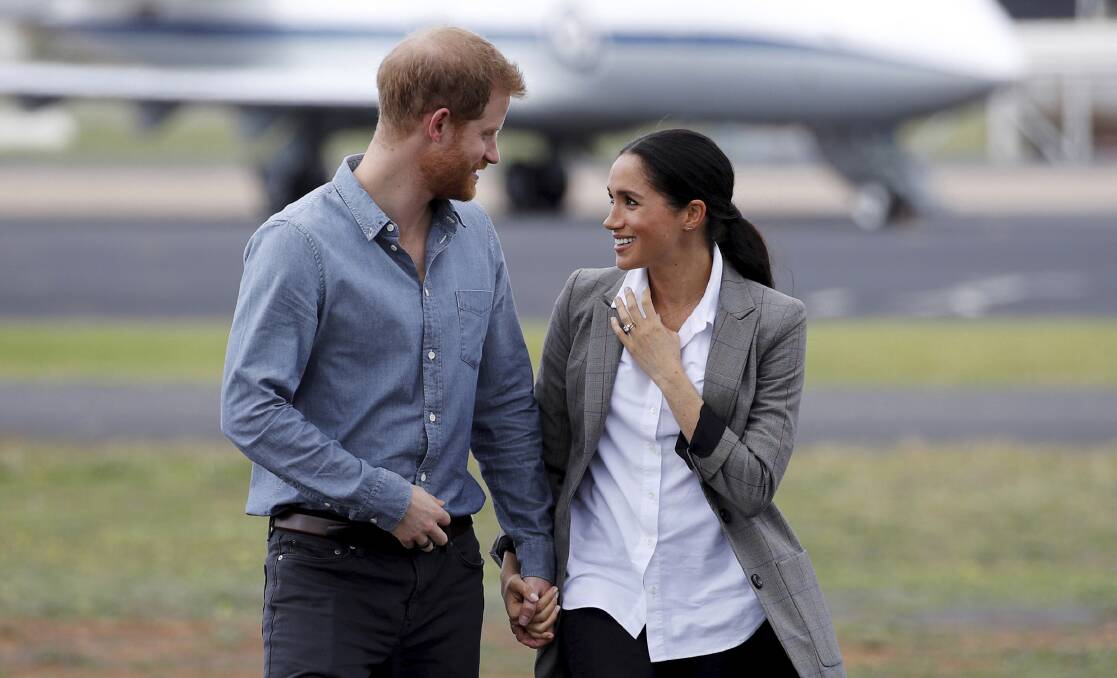 Britain's Prince Harry and Meghan, Duchess of Sussex arrive in Dubbo on Wednesday. Photo: Phil Noble/Pool via AP